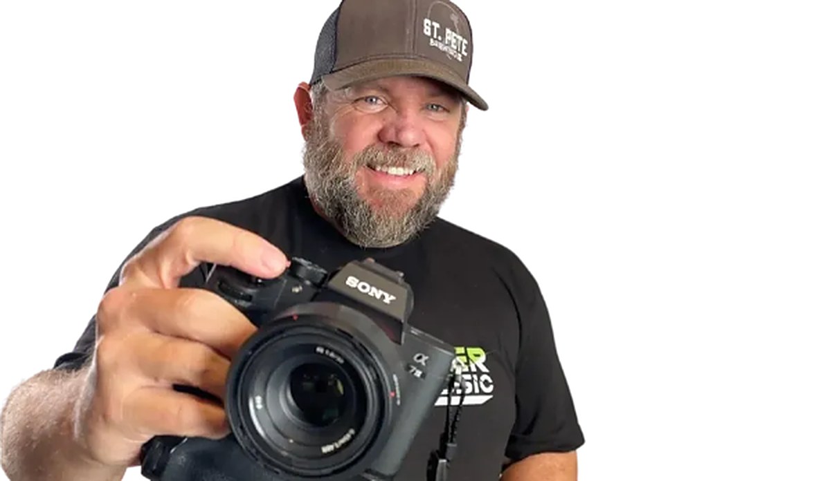 Daniel Ward, founder of Ward Media, holding a camera